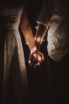 Close up photo of couple holding hands
