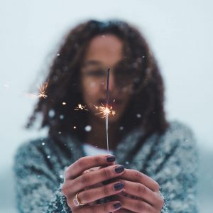 Image of person holding a sparkler