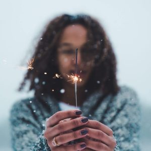 Image of person holding a sparkler